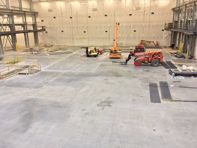 A concrete contractor installing a warehouse floor.