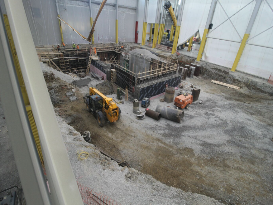 concrete foundation contractors building a machine foundation in an industrial warehouse